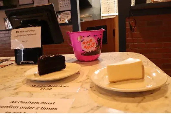 Chocolate cake and cheesecake on plates